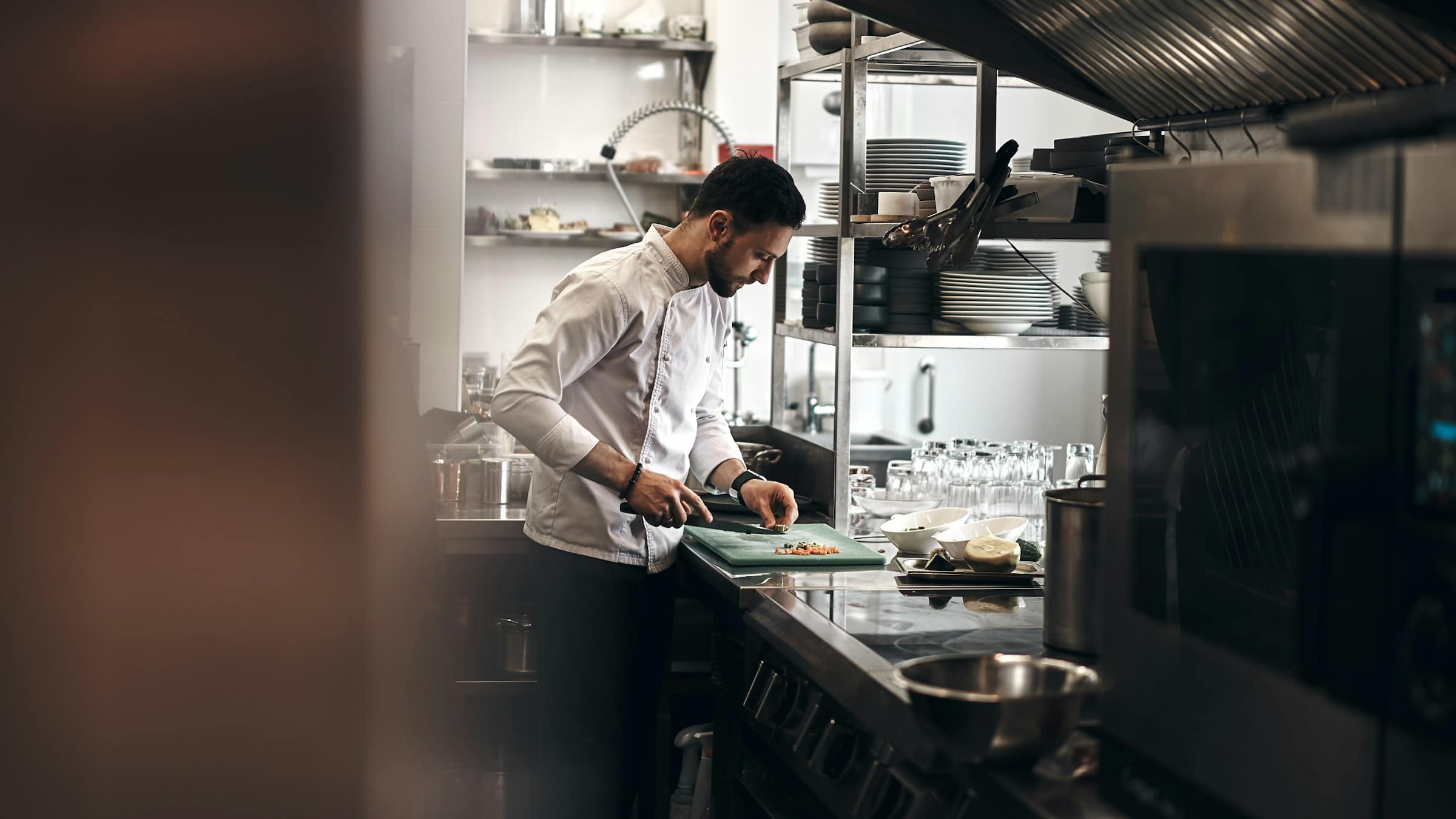Chef preparing ingredients in a restaurant kitchen